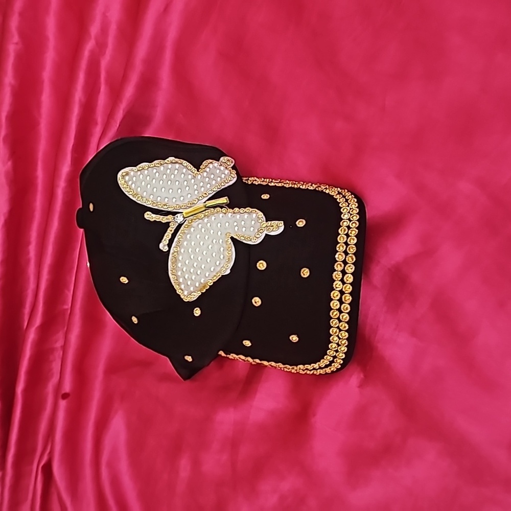 Brand new hat with butterfly.